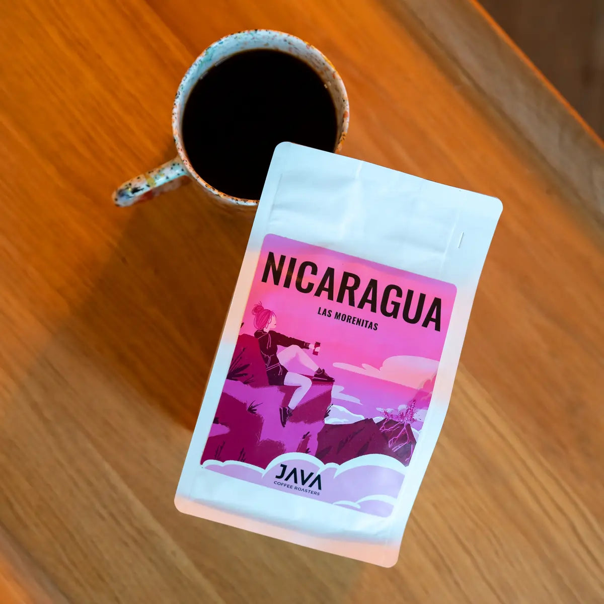 JAVA Coffee Nicaragua Las Morenitas kawa specialty – opakowanie kawy i filiżanka czarnej kawy widok z góry